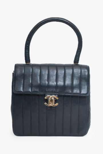 Chanel™ 1991-94 Black Vertical Quilted Lambskin Top Handle Bag