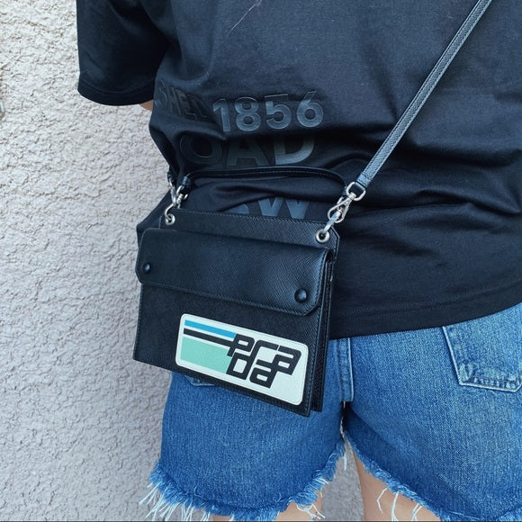 PRADA Mini bandoliera saffiano patch